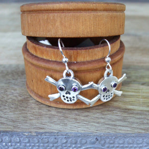 Sterling Silver Skull and Crossbone Drop Earrings set with Amethyst